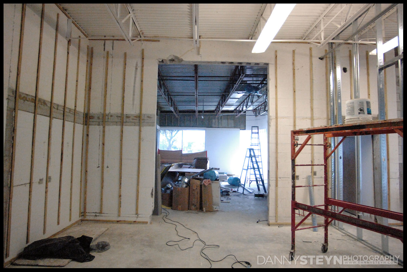 Furring strips for drywall going up in the Prop Room, looking into the Natural Light Studio