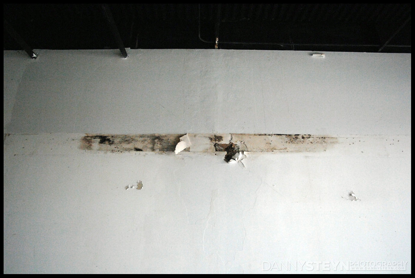 After rmoving a storage shelf we discovered this drywall rot in the Main Studio. Need to establish what is causing this.